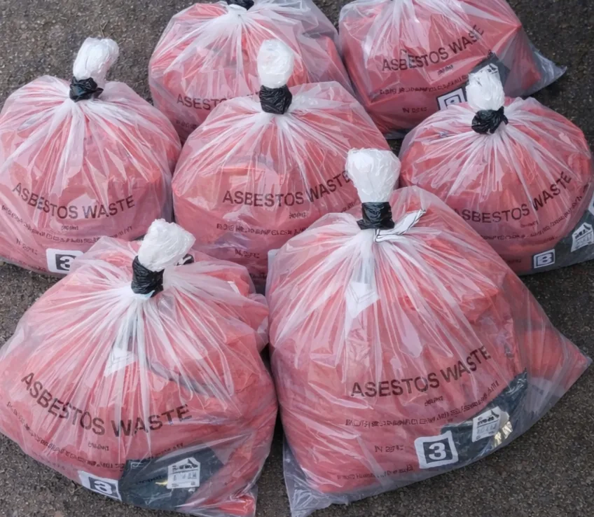 Double bagged and labelled asbestos waste ready for licensed disposal Asbestos Removal Team Ltd