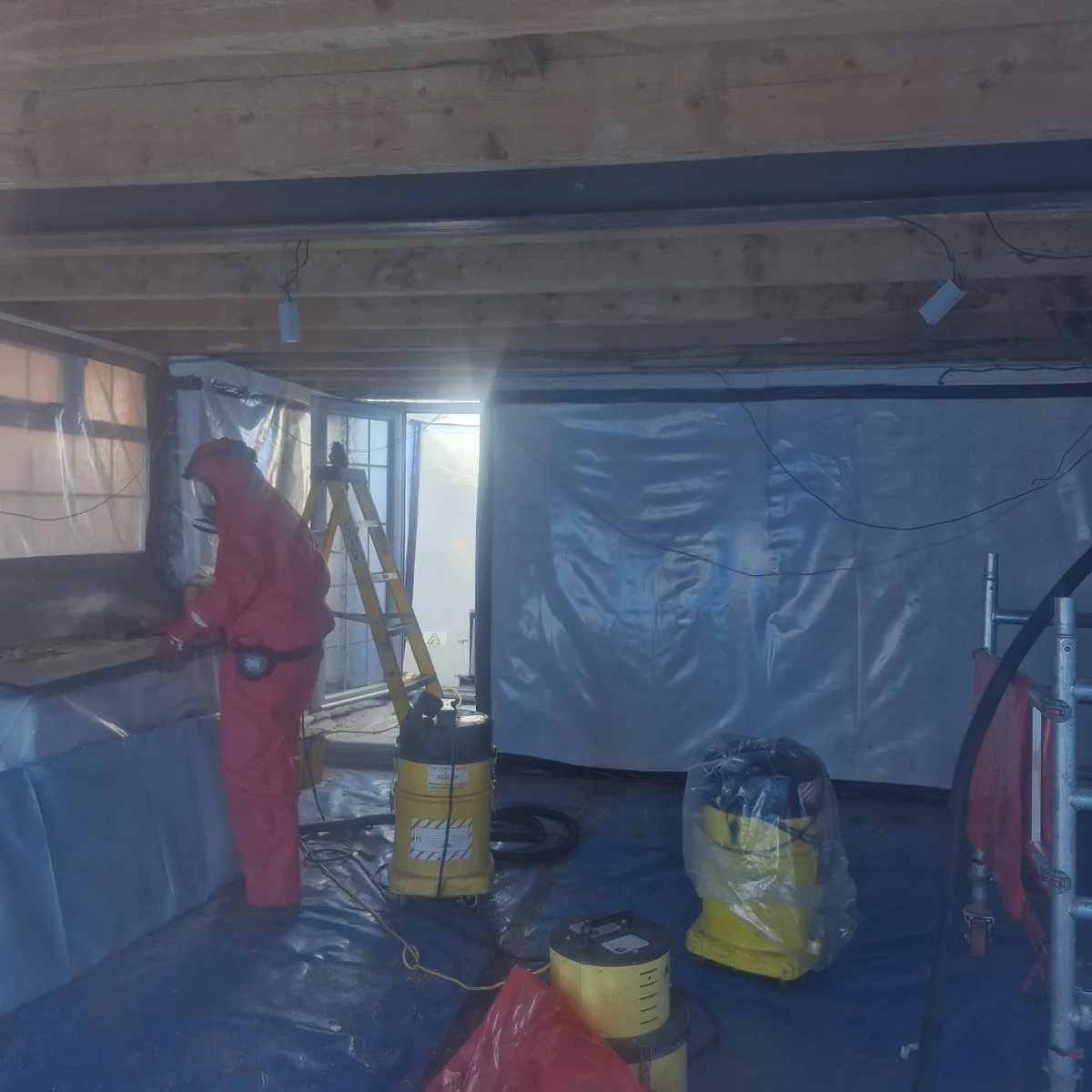Asbestos containing materials sealed and protected inside a controlled work area Asbestos Removal Team Ltd